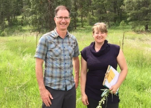OCCP’s Scott Boswell and Tanis Gieselman smile for the camera while standing in a field