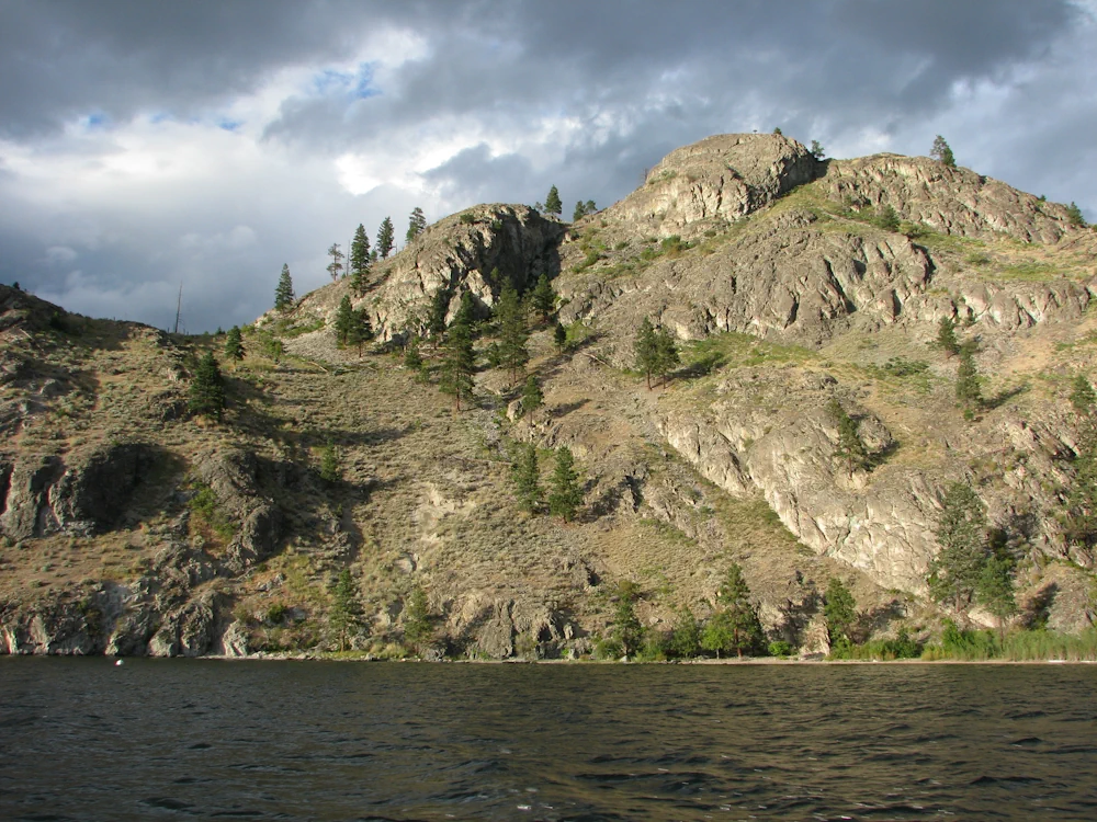 Stretch of rocky Okanagan Lake shoreline of Okanagan Mountain Provincial Park